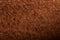 Brown fluffy background with stitches