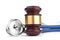 Brown gavel and a medical stethoscope