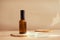Brown glass cosmetic bottle on minimalist background