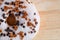 Brown glazed donut on wooden background