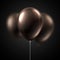Brown glossy balloons isolated on black background. Festive deco