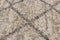 Brown and gray background with cross, fleecy carpet texture. Focus with shallow depth of field