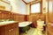 Brown and green antique bathroom with plank paneled walls and gr