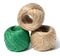 Brown and green skeins of jute rope on a white isolated background