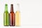 Brown, green, transparent longneck beer bottles 500ml, mock up. Template for advertising, design, branding identity on white wood