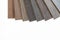 Brown and grey laminate flooring samples on white background