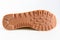 Brown grooved sole sneaker on a white background.