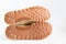 Brown grooved sole sneaker on a white background.