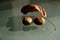 Brown hazelnuts and red wood mulch on reflective glass. closeup. fall season