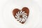 Brown heart shaped cookie with sugar powder