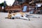 A brown homeless dog is sleeping on the warm floor at buddhism temple