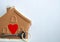 Brown house heart and key on a white background. Sumbol of family and love. Space for text