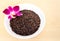 Brown Jasmine Rice with Orchid Flower in a White Bowl