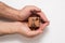 Brown jewelry box in man hands. Present. White background