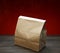 Brown kraft paper bag for lunch or food on wooden table