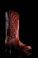 A brown leather cowboy boot