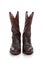 Brown leather cowboy boots on white