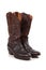 Brown leather cowboy boots on white