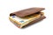 Brown leather mens wallet with a stack of Euro banknotes inside, isolated on a white background, 50 euros visible.