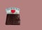 Brown leather wallet with red heart. Belarusian hundred-ruble bills stick out of the wallet.