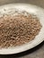 Brown Linseed on a Pewter Plate