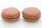 Brown macaroon on white background