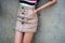 brown mini skirt on mannequin doll standing in the street