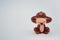 Brown monkey doll close eyes on white background