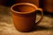 A brown mug. Coffees Embrace. A Toasty Brown Mug. Generative AI