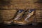 Brown new leather boots vintage background. Worn shoes on the ba
