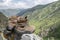 Brown nubuck trekking boots on a mountains background.