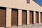 Brown numbered self storage and mini storage garage units I