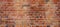 Brown orange damaged rustic brick wall texture banner panorama brickwork stonework masonry