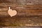 Brown paper - cardboard heart on clothespin on string on rustic