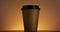 Brown paper coffee cup spinning. Disposable cup for hot drinks. Espresso, latte, cappuccino for take away.