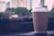 Brown paper cup of coffee photos in the park with copy space. Concept of beverage of enjoy drink and relax with happy time to get