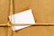 Brown paper parcel with blank address label and envelope, copy space