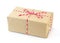 Brown paper parcel tied with red and white string