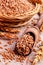 Brown peeled wheat grits on a textile background