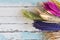 Brown, Pink, Green,Blue, Yellow and Purple bouquet Grass flowers on old vintage wooden background with copy space