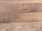 Brown planks of hardwood in form of a cool natural background or wallpaper used for surface coverage for indoors and outdoors