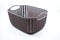 brown plastic basket with woven pattern on a white