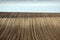 Brown plowed field farmland landscape