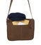 Brown postman bag with mails and hat on white background