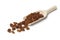 Brown raisins on a wooden spoon