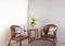 Brown rattan chairs and table