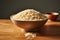 Brown rice, uncooked and fresh, in a clean white bowl