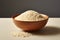 Brown rice, uncooked and pristine, displayed in a clean white bowl