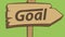 Brown road sign of a goal