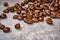 Brown roasted coffee beans closeup grey beton background